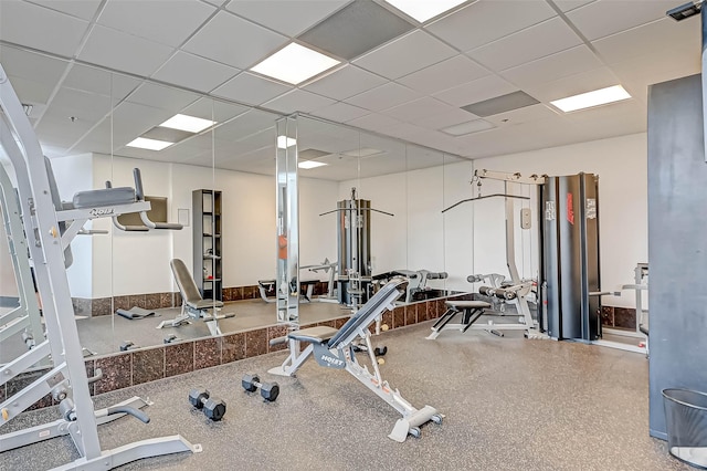 exercise room featuring a paneled ceiling