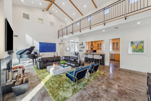 living room with concrete flooring, high vaulted ceiling, and beam ceiling