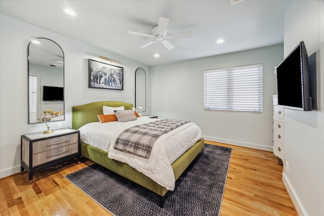 bedroom with wood-type flooring and ceiling fan