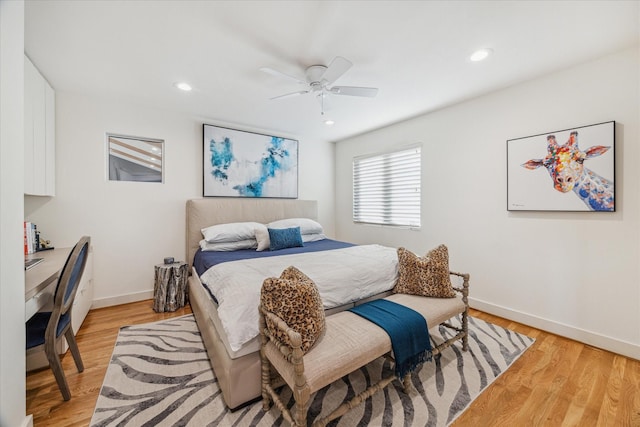 bedroom featuring ceiling fan and light hardwood / wood-style flooring