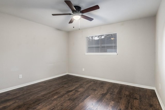 empty room with dark wood-type flooring and ceiling fan