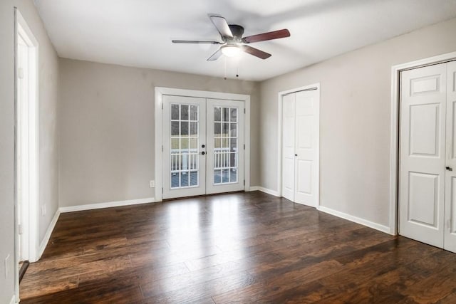 unfurnished room featuring french doors, ceiling fan, and dark wood-type flooring