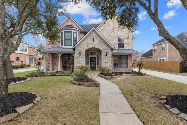 view of front of home featuring a porch and a front lawn