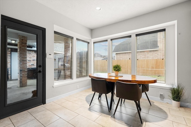 dining space with light tile patterned floors