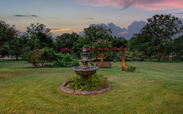 view of yard at dusk