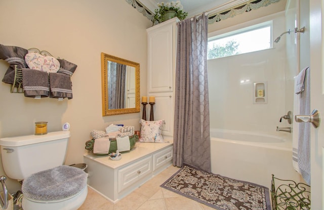 bathroom with toilet, tile patterned flooring, and shower / tub combo