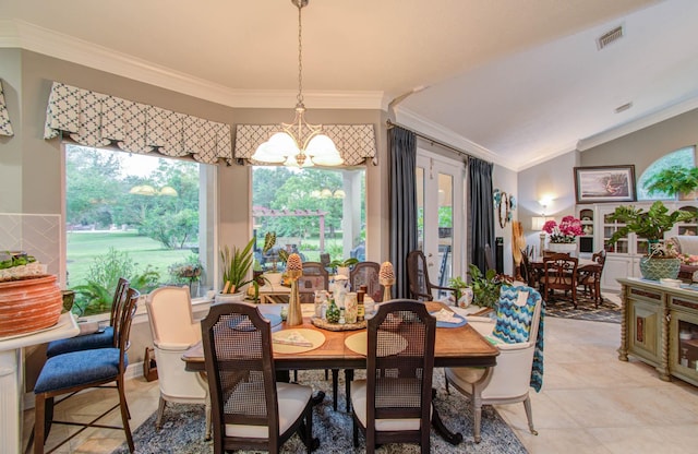 dining area with crown molding, lofted ceiling, and a notable chandelier