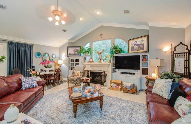 tiled living room featuring vaulted ceiling, ornamental molding, and ceiling fan