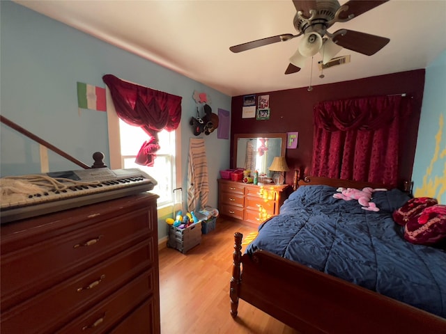 bedroom featuring light hardwood / wood-style flooring and ceiling fan