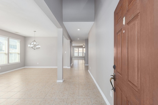 interior space featuring a chandelier and light tile patterned floors