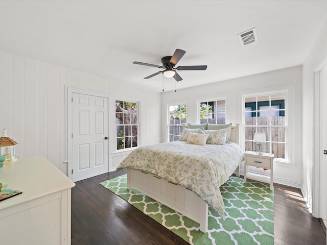 bedroom featuring ceiling fan and dark hardwood / wood-style flooring