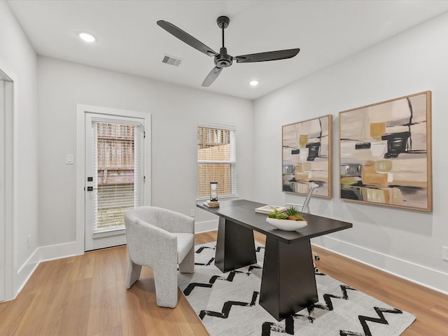 office area featuring light hardwood / wood-style flooring and ceiling fan