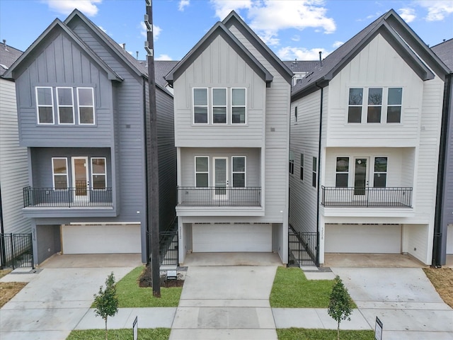 view of front of home featuring a garage and a balcony