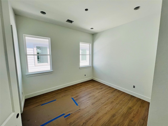 unfurnished room featuring hardwood / wood-style floors