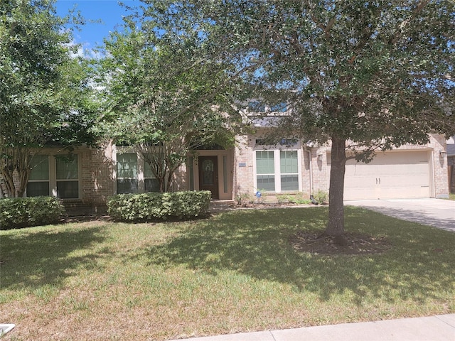 obstructed view of property featuring a garage and a front lawn