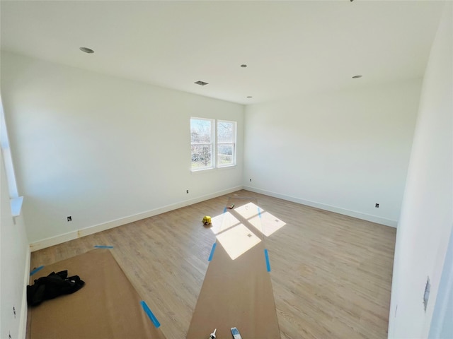 unfurnished room with light hardwood / wood-style floors