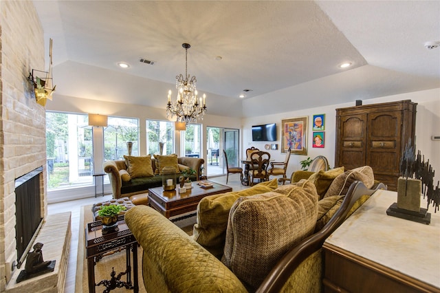 living room with a fireplace, vaulted ceiling, and wood-type flooring