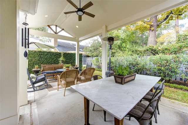 view of patio / terrace with ceiling fan and an outdoor living space