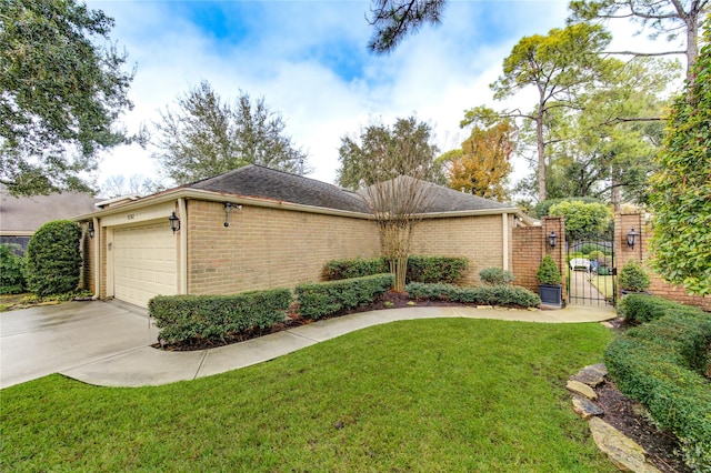 view of front facade with a garage and a front lawn