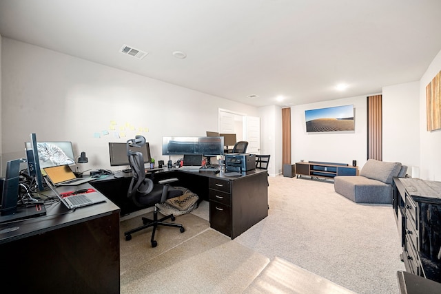 office with light carpet and visible vents