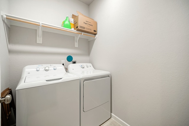 laundry room featuring laundry area, independent washer and dryer, and baseboards