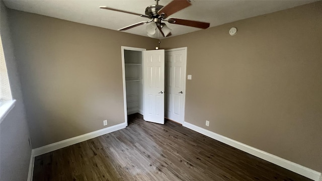 unfurnished bedroom with wood-type flooring, ceiling fan, and a closet