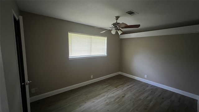 unfurnished room with ceiling fan and hardwood / wood-style floors