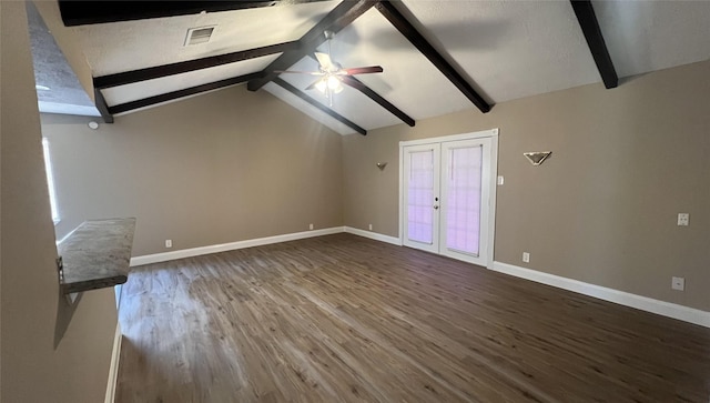 unfurnished living room with lofted ceiling with beams, dark hardwood / wood-style floors, ceiling fan, and french doors