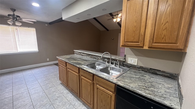 kitchen with sink, light tile patterned floors, dishwasher, ceiling fan, and dark stone countertops