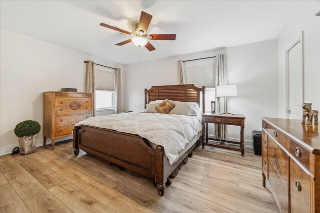 bedroom with ceiling fan and light hardwood / wood-style flooring