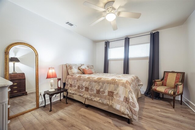 bedroom with light hardwood / wood-style flooring and ceiling fan