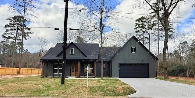 modern farmhouse with a garage and a front yard