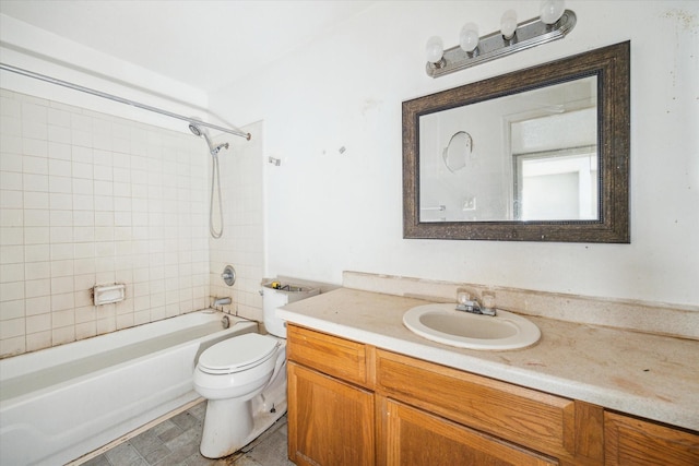 full bathroom with vanity, toilet, and tiled shower / bath combo