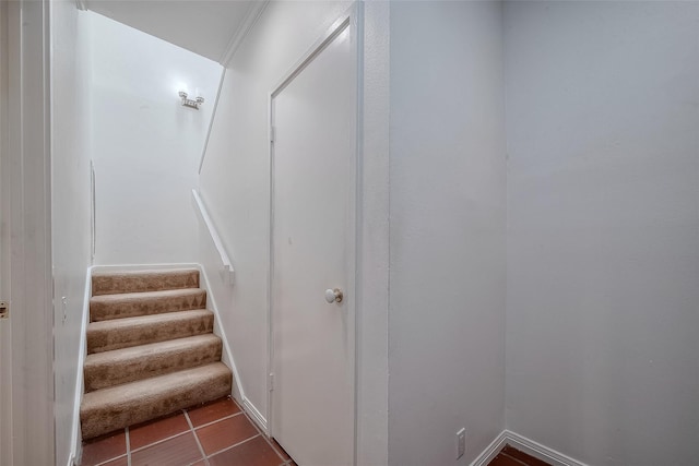 stairway with tile patterned flooring