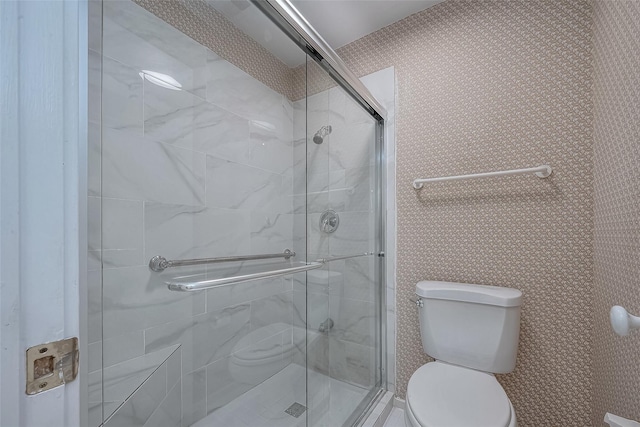 bathroom with toilet and walk in shower