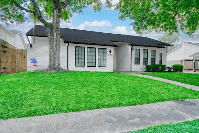 ranch-style house with a front yard