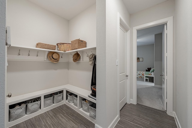 mudroom with dark hardwood / wood-style floors