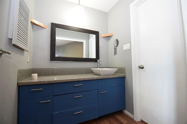 bathroom featuring vanity and wood-type flooring