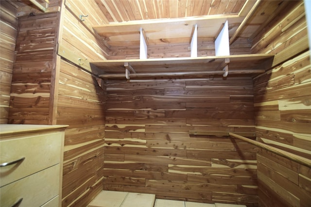 spacious closet with tile patterned floors