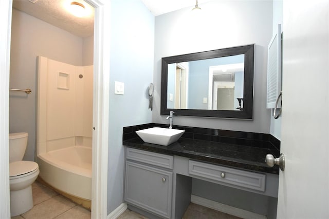 full bathroom featuring vanity,  shower combination, tile patterned floors, and toilet