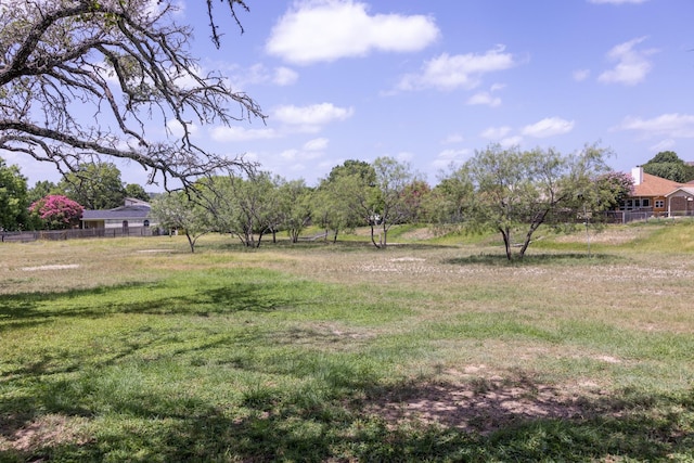 view of yard with a rural view