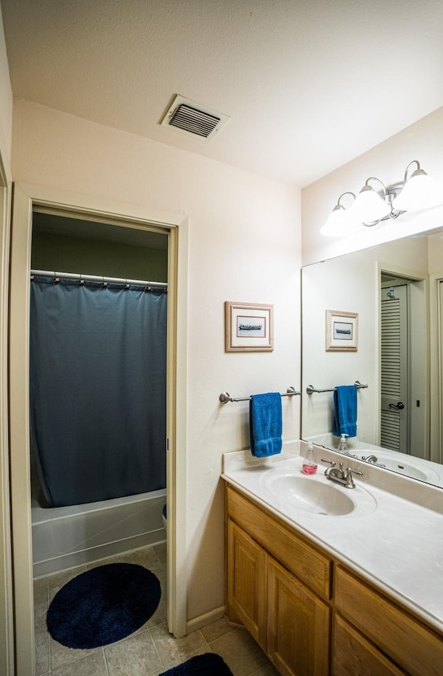 full bathroom with vanity, shower / bath combo, tile patterned floors, and toilet