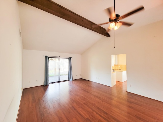 empty room with hardwood / wood-style flooring, vaulted ceiling with beams, and ceiling fan