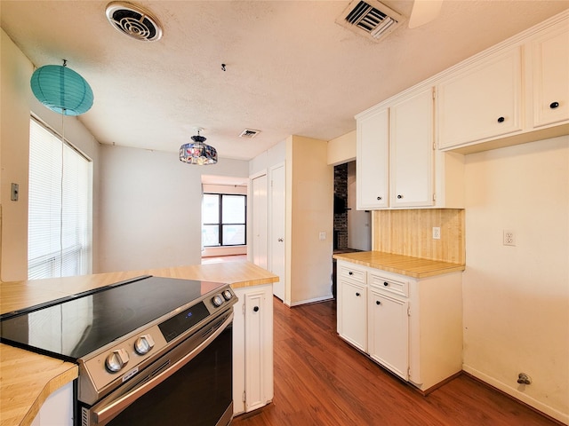 kitchen with white cabinetry, backsplash, dark hardwood / wood-style floors, a textured ceiling, and stainless steel range with electric cooktop