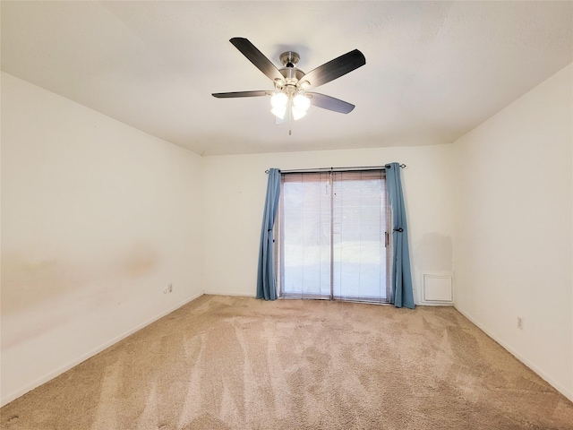 empty room with light carpet and ceiling fan