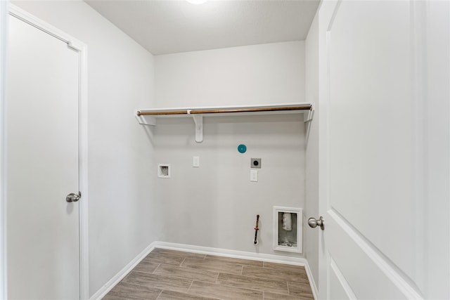 laundry area featuring hookup for a washing machine, hookup for a gas dryer, laundry area, wood tiled floor, and electric dryer hookup