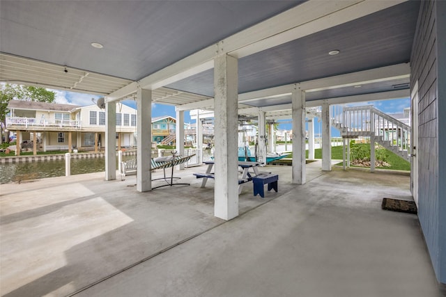 view of patio featuring a water view