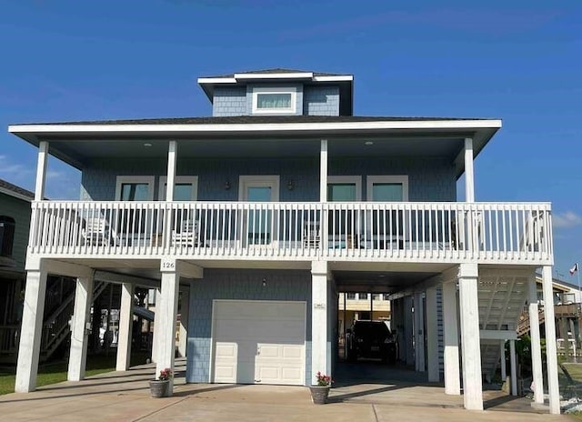 beach home featuring a carport and a garage