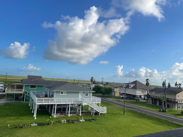 back of house featuring a yard