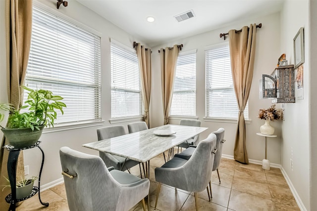 dining area featuring light tile patterned floors